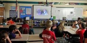 students watch video
